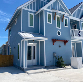 Blue coastal exterior of Beach Glass on the Island
