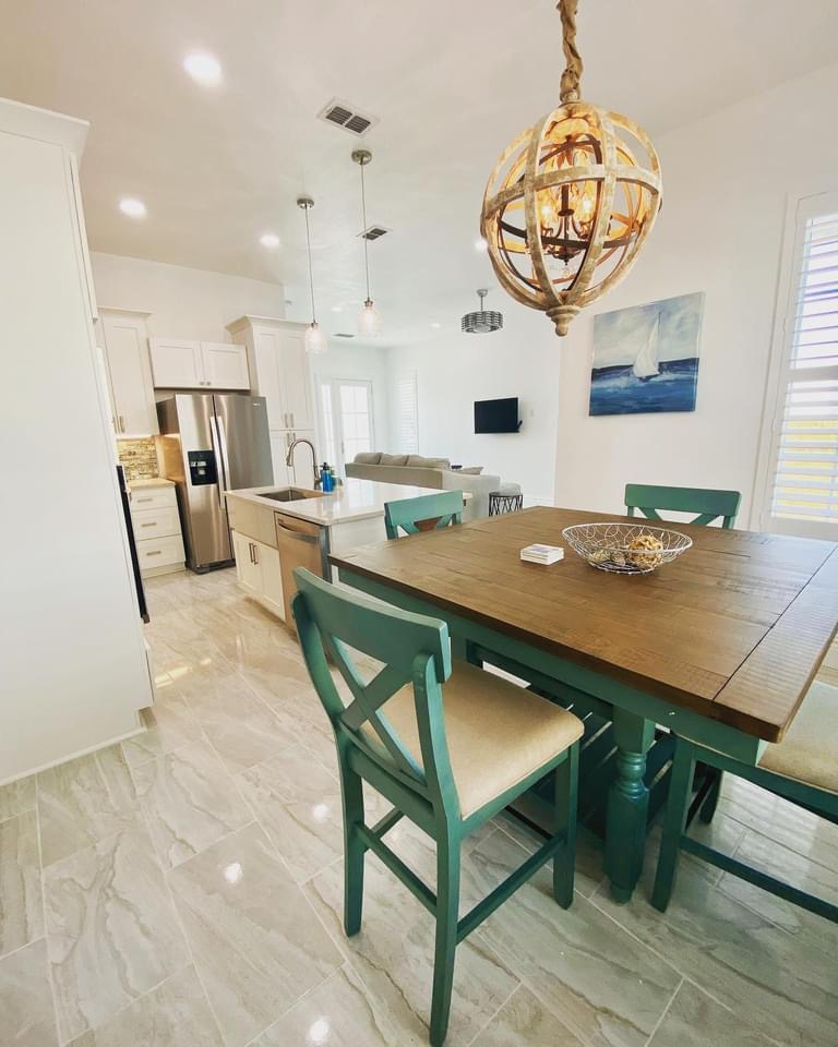 Dining table with sea-glass green chairs
