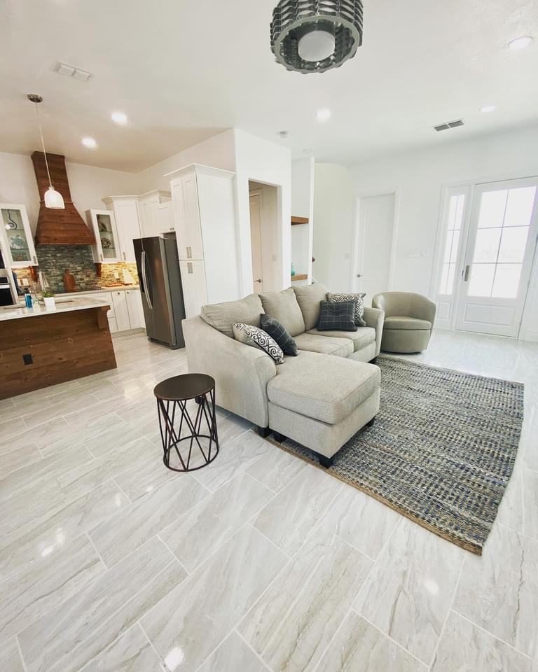 Bright living room with a sectional sofa and coastal decor