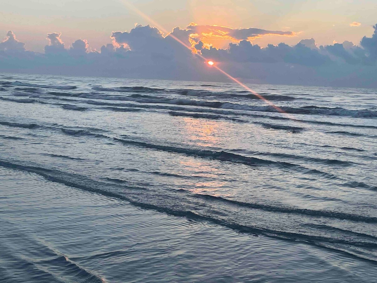 Sunrise over the Gulf waves on Padre Island